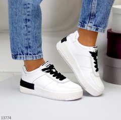 Жіночі спортивні шкіряні кросівки itts білого кольору з чорними шнурками