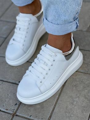Білі кросівки із натуральної шкіри з сріблястим задником