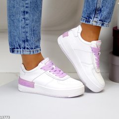 Жіночі спортивні шкіряні кросівки itts білого кольору з фіолетовими шнурками