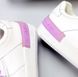 Жіночі спортивні шкіряні кросівки itts білого кольору з фіолетовими шнурками