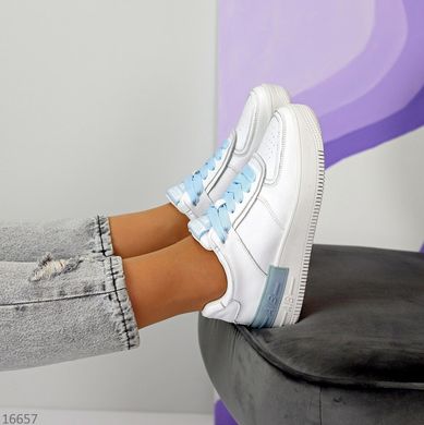 жіночі спортивні шкіряні кросівки itts білого кольору з голубими шнурками